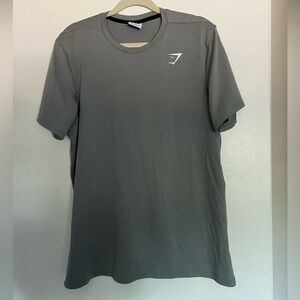 Men’s Grey gymshark athletic short sleeved shirt. Size large.